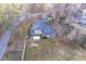 Aerial view of the home with a large backyard, showcasing the layout and surrounding landscape at 3012 Optimist Farm Rd, Apex, NC 27539