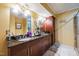 Bathroom features a granite vanity with double sinks, a glass shower and tile floors at 3012 Optimist Farm Rd, Apex, NC 27539