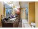 Bathroom features a granite vanity with double sinks, a glass shower and tile floors at 3012 Optimist Farm Rd, Apex, NC 27539