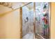 Bright bathroom with a glass-enclosed shower featuring tile walls and a built-in bench at 3012 Optimist Farm Rd, Apex, NC 27539
