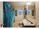 Bathroom featuring a blue shower curtain and a vanity with a modern sink at 3012 Optimist Farm Rd, Apex, NC 27539