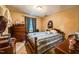 Bedroom with wood furnishings, blue accents, and a cozy bed setting at 3012 Optimist Farm Rd, Apex, NC 27539