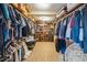Walk-in closet offers custom shelving, hanging rods, and ample storage for clothing at 3012 Optimist Farm Rd, Apex, NC 27539