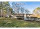 Cozy home with a well-maintained lawn and mature trees, offering a peaceful suburban setting at 3012 Optimist Farm Rd, Apex, NC 27539