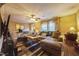 Comfortable living room with neutral tones, large sectional, and a ceiling fan at 3012 Optimist Farm Rd, Apex, NC 27539