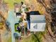 Aerial shot of a home featuring landscaped outdoor living spaces and a gravel driveway at 3227 Morrow Farm Ln, Chapel Hill, NC 27516