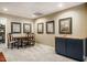 Basement featuring neutral walls, cabinets with sink, dining table and artwork at 3227 Morrow Farm Ln, Chapel Hill, NC 27516