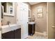 Cozy bathroom with two undermount sinks, grey cabinets, artwork, and neutral walls at 3227 Morrow Farm Ln, Chapel Hill, NC 27516