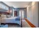 Spacious bedroom with wood floors, french doors to a deck, and wall of closets at 3227 Morrow Farm Ln, Chapel Hill, NC 27516
