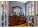 Dressing room with wood floors and a dark wood dresser with large mirror at 3227 Morrow Farm Ln, Chapel Hill, NC 27516