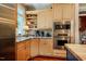 Gourmet kitchen with stainless steel appliances, granite countertops, and ample cabinetry at 3227 Morrow Farm Ln, Chapel Hill, NC 27516