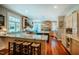 Spacious kitchen featuring granite countertops, stainless steel appliances, and a large center island with seating at 3227 Morrow Farm Ln, Chapel Hill, NC 27516