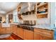Modern kitchen featuring professional-grade stovetop, granite counters, and custom cabinets at 3227 Morrow Farm Ln, Chapel Hill, NC 27516