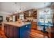 Beautiful kitchen with an island, breakfast nook, custom cabinets, and modern appliances at 3227 Morrow Farm Ln, Chapel Hill, NC 27516