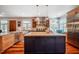 Kitchen with stainless appliances, butcher block island, and ample cabinets at 3227 Morrow Farm Ln, Chapel Hill, NC 27516