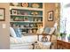 Cozy living area with a built-in bookshelf, comfortable daybed, and bright natural light at 3227 Morrow Farm Ln, Chapel Hill, NC 27516