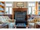 Elegant living room with built-in bookshelves flanking a fireplace, creating a warm and inviting atmosphere at 3227 Morrow Farm Ln, Chapel Hill, NC 27516