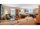 Open concept living area with modern kitchen, hardwood floors, and comfortable seating arrangement at 3227 Morrow Farm Ln, Chapel Hill, NC 27516