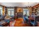 Spacious living room featuring a fireplace, built-in bookshelves and dining area at 3227 Morrow Farm Ln, Chapel Hill, NC 27516