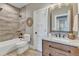 Neutral bathroom featuring updated vanity with granite counters and a shower-tub combination at 3240 Donlin Dr, Wake Forest, NC 27587