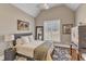 Bedroom with a vaulted ceiling, a window with blinds, and a decorative area rug at 3240 Donlin Dr, Wake Forest, NC 27587