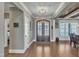 Elegant foyer featuring hardwood floors, a coffered ceiling, and a striking double door entrance at 3240 Donlin Dr, Wake Forest, NC 27587