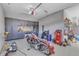 Clean garage with epoxy flooring and built in cabinetry for storage and organization at 3240 Donlin Dr, Wake Forest, NC 27587