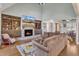 Cozy living room featuring a stone fireplace, custom built-ins, and a comfortable seating area at 3240 Donlin Dr, Wake Forest, NC 27587