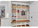 Mudroom with storage bench and wall hooks. Features a tiled wall and built in storage at 3240 Donlin Dr, Wake Forest, NC 27587