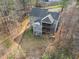 Aerial view of a blue two-story home with a screened porch, decks, and a spacious backyard at 3541 Rugby Rd, Durham, NC 27707