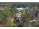 An aerial view of a gray house surrounded by many trees at 3541 Rugby Rd, Durham, NC 27707