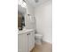 Bathroom with white vanity, tile floor, and a mirror at 3541 Rugby Rd, Durham, NC 27707
