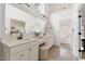 Bathroom featuring a dual sink vanity, framed mirror and soaking tub at 3541 Rugby Rd, Durham, NC 27707