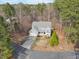Aerial view of two-story blue house featuring a two-car garage and lovely landscaping at 3541 Rugby Rd, Durham, NC 27707