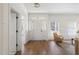Inviting foyer with hardwood floors, white trim, and natural light, leading into a modern living space at 3541 Rugby Rd, Durham, NC 27707