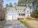 Charming two-story home with a two-car garage, inviting entrance, and well-maintained landscaping at 3541 Rugby Rd, Durham, NC 27707