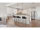 Open-concept kitchen featuring a breakfast bar, pendant lighting, and modern appliances at 3541 Rugby Rd, Durham, NC 27707