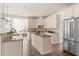 Bright kitchen features granite countertops, tile backsplash, and stainless steel appliances at 3541 Rugby Rd, Durham, NC 27707