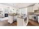 Spacious kitchen featuring granite countertops, stainless steel appliances, and a center island with breakfast bar at 3541 Rugby Rd, Durham, NC 27707