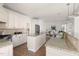 Bright kitchen features granite countertops, tile backsplash, and stainless steel appliances at 3541 Rugby Rd, Durham, NC 27707