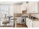 Bright kitchen features granite countertops, tile backsplash, and stainless steel appliances at 3541 Rugby Rd, Durham, NC 27707