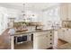 Bright kitchen with tile backsplash, granite countertops, and stainless steel microwave at 3541 Rugby Rd, Durham, NC 27707