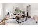 Cozy living room featuring a stylish couch, modern art, and an inviting atmosphere for relaxation and conversation at 3541 Rugby Rd, Durham, NC 27707