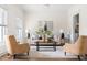 Bright living room with modern decor, neutral tones, stylish furnishings, and wainscoting at 3541 Rugby Rd, Durham, NC 27707