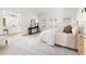 Spacious main bedroom with ensuite bathroom, console table, and French doors at 3541 Rugby Rd, Durham, NC 27707