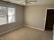 Neutral bedroom featuring carpeted floors, a ceiling fan, and a window for natural light and ventilation at 3709 Valley Pine Ct, Wendell, NC 27591