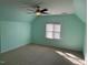 Bright bedroom featuring a ceiling fan, vaulted ceiling, and a window providing ample natural light and ventilation at 3709 Valley Pine Ct, Wendell, NC 27591