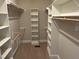 This roomy walk-in closet features built-in shelving and hanging racks at 3709 Valley Pine Ct, Wendell, NC 27591