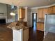 Kitchen features stainless steel appliances and a breakfast bar at 3709 Valley Pine Ct, Wendell, NC 27591