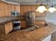 Kitchen features stainless steel appliances and granite countertops at 3709 Valley Pine Ct, Wendell, NC 27591